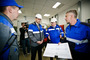 Сергей Молчанов и Денис Паслер с работниками установки сжижения гелия